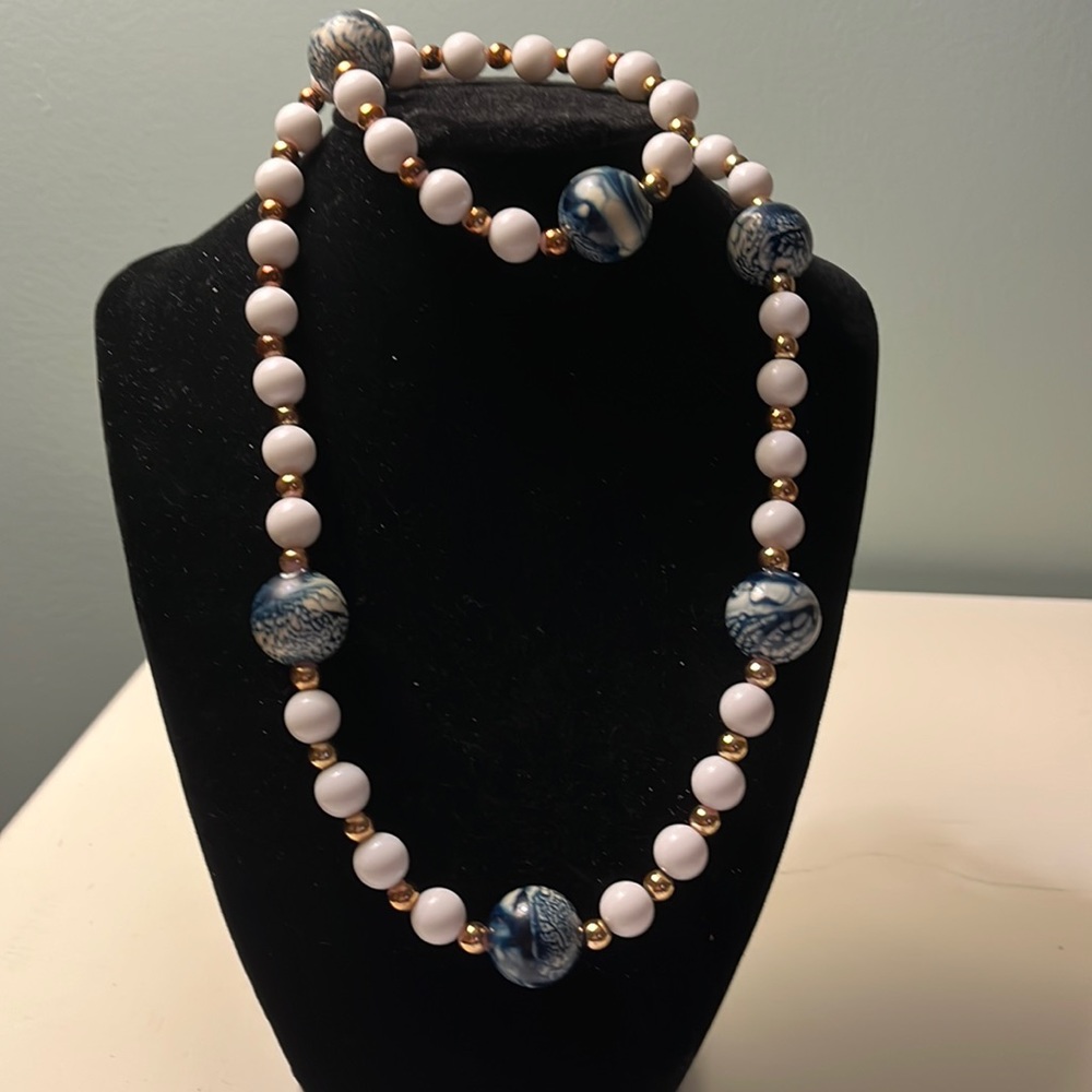 N45. Long blue and white beaded necklace.